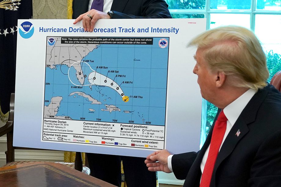 President Donald Trump discusses the Hurricane Dorian forecast with a line drawn over Alabama. 